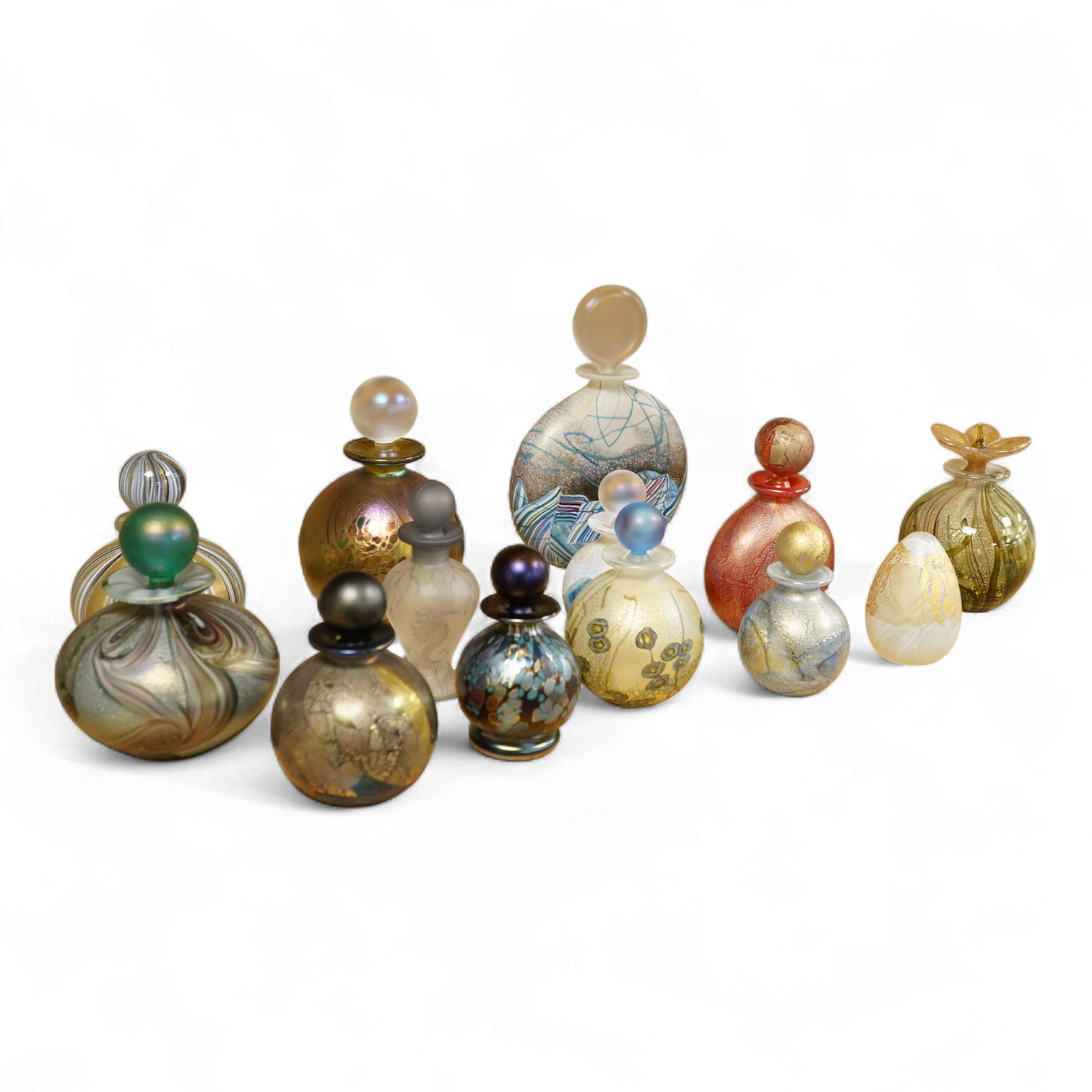 A collection of thirteen Isle of Wight scent bottles, tallest 15cm